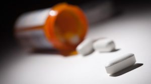 An open bottle of prescription pills