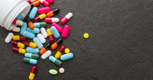 Many pills and tablets on black background for decorate and design project.