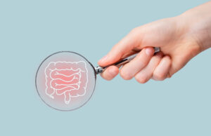 Intestine disease concept. Magnifying glass studying guts, bowel. Gastroenterology. High quality photo