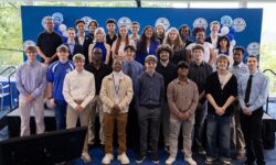 a group of students, BlueSky Institute's Cohort 4, poses for a photo at Signing Day