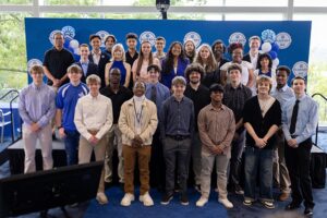 a group of students, BlueSky Institute's Cohort 4, poses for a photo at Signing Day