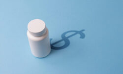 Plastic Bottle with Tablets and a shadow in the Dollar Symbol. The concept of expensive Pharmaceutical preparations and Overpriced medicine prices.