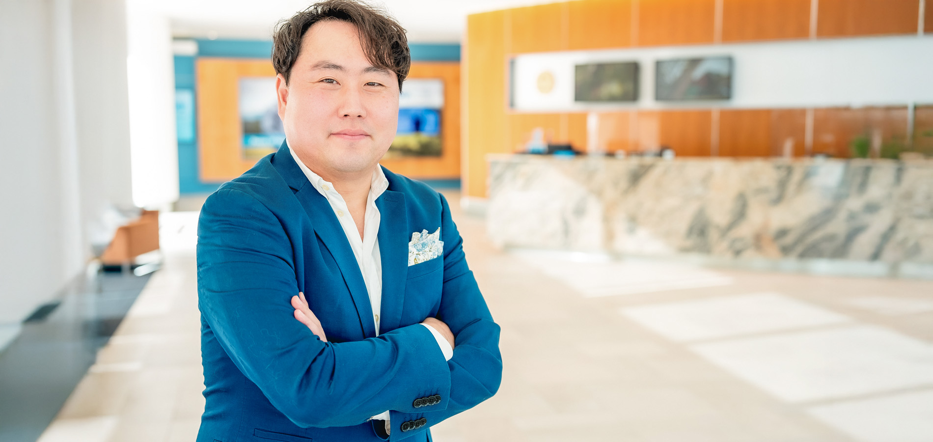 Photo of Jae in an office setting