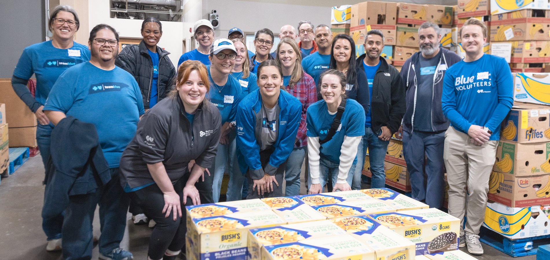 Group of Team Blue volunteers at a food bank