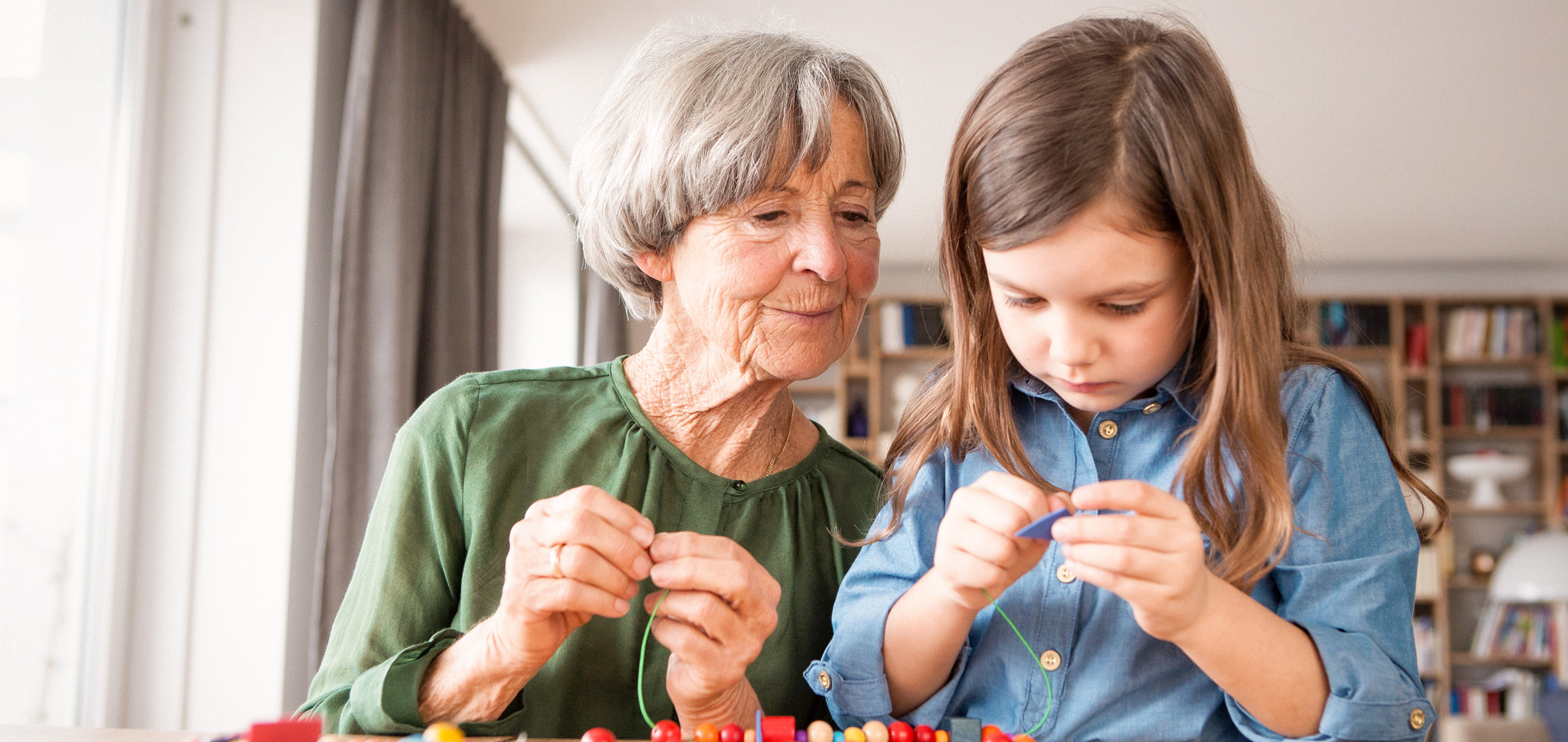 older adult with young child indoors
